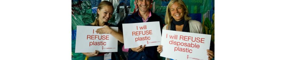 Three humans bearing signs proclaiming they will REFUSE plastic!